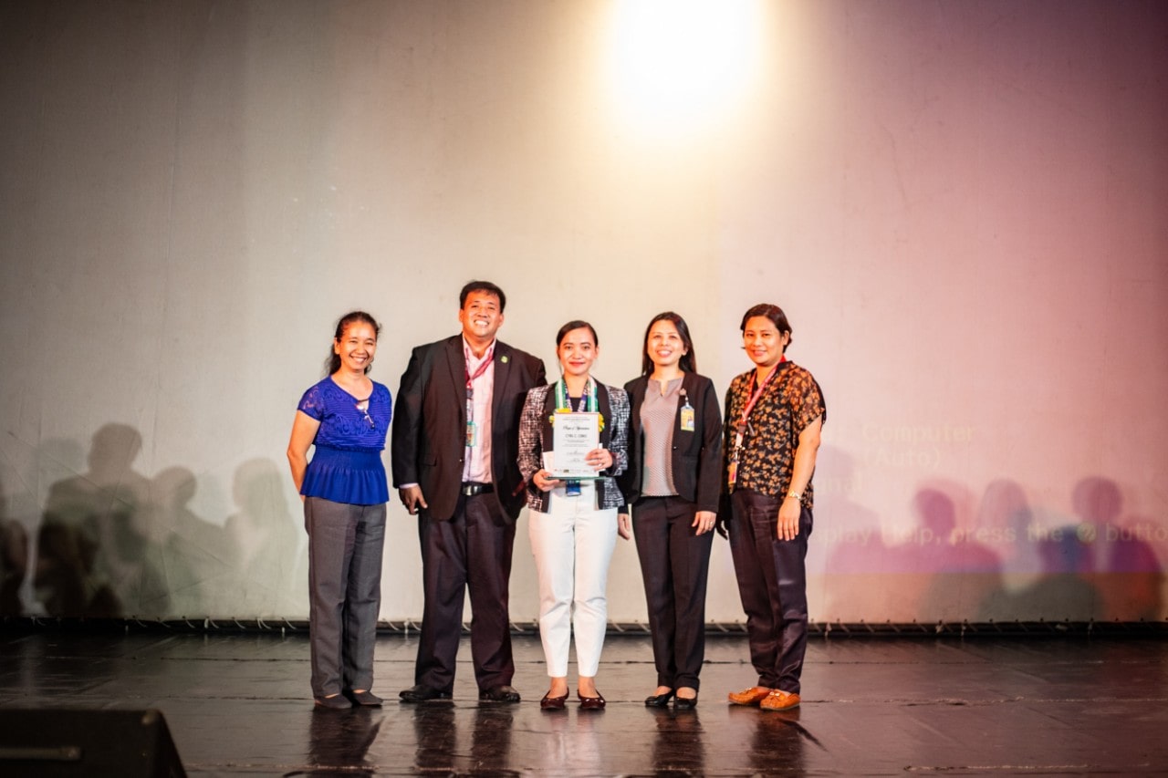 Cyril Cerio, Esco Biosafety Institute Ambassador, receiving the Plaque of Appreciation