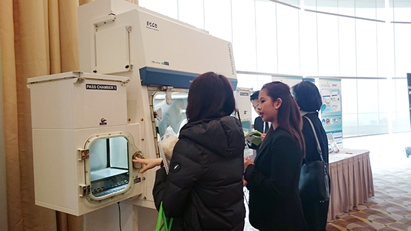Ms. Zharmaine Solivet, Product Specialist for Esco Healthcare, discussing about HPI-G3 to a visitor 