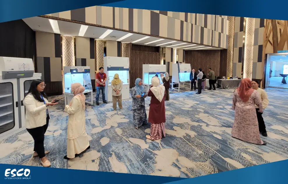 The audiences are discussing the Esco products with Esco Malaysia's employees