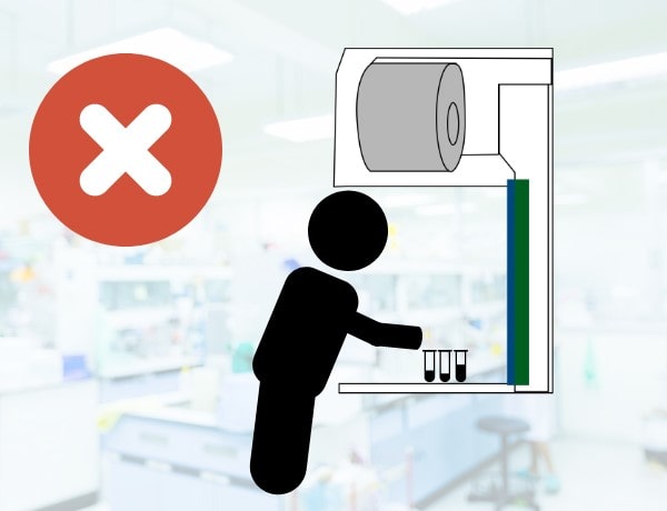 Incorrect position when working in the Laminar Flow Cabinet Incorrect position when working in the Laminar Flow Cabinet